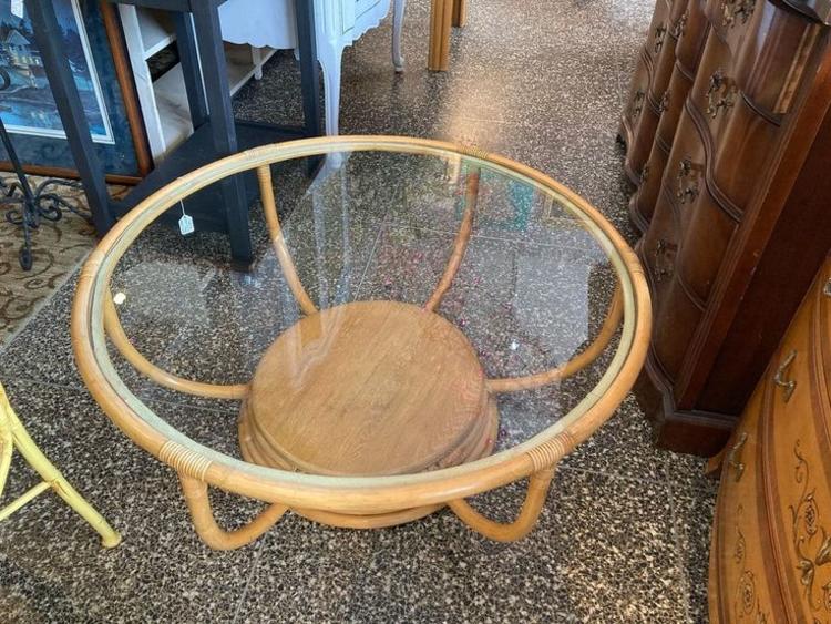 Round rattan coffee table. 38.5” x 16.5” 