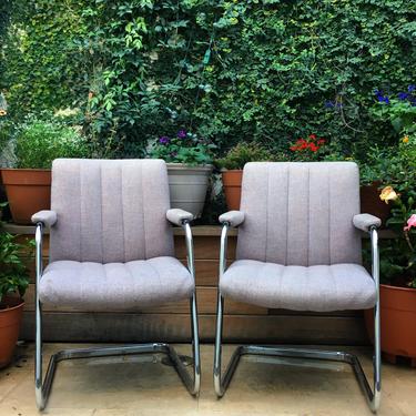 2 chrome arm chairs with grey upholstery