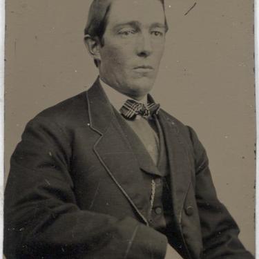 Tintype Photograph of a Seated Man Wearing a Bowtie 
