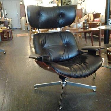 Leather Eames - style swivel lounge chair.  1960s chic swivel lounger in supple chocolate -black leather. Now at Hunted House.