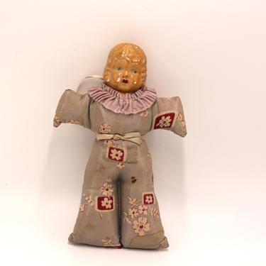 vintage doll with fabric body and composition head 