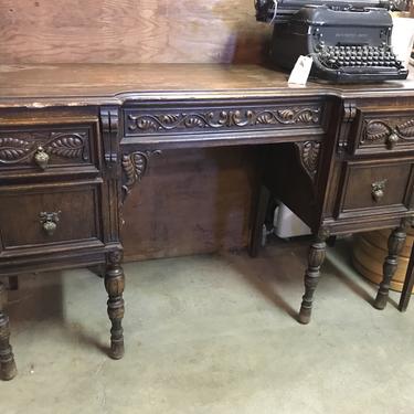 Carved Oak Eastlake desk with acorn pullls 50” W 18” D 39 1/4” H