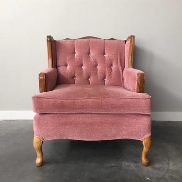 vintage tufted pink armchair.