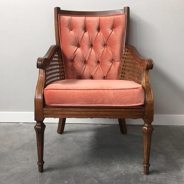 vintage plush coral pink cane arm chair.