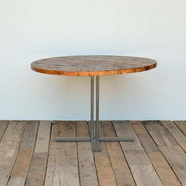 Round Top Pedestal Dining Table in reclaimed wood and steel legs in your choice of color, size and finish. 
