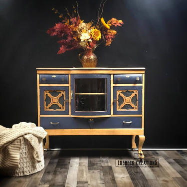 Antique Buffet. Natural wood tone sideboard. Blue and wood credenza. Three drawer, 3 cabinet storage. 