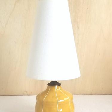 Yellow bedside table lamp. White stripes, matching handmade finial 