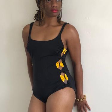 80s cut out swim suit bathing suit / vintage black one piece maillot swimsuit with peek a boo cutaway yellow bows side | S 