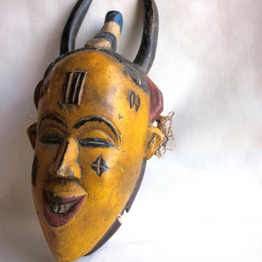 Vintage Yellow Painted Wood West African Cote D'Ivoire Baule or Yaure Tribal Portrait Mask with Eye Holes, Horns and Smiling Mouth 