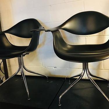                   Pair of iconic Nelson Swag Leg Armchairs. Designed by George Nelson for