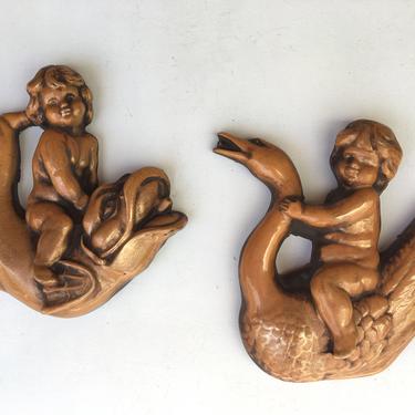 Mid Century Modern Set Of Chalkware Putti Riding Swan And Fish, Cherubic Children Chalkware Wall Plaques, Faux Fountain Figures 
