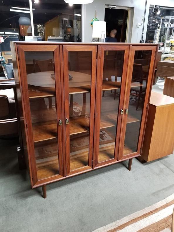                   Mid-Century Modern walnut bookcase / cabinet with glass doors