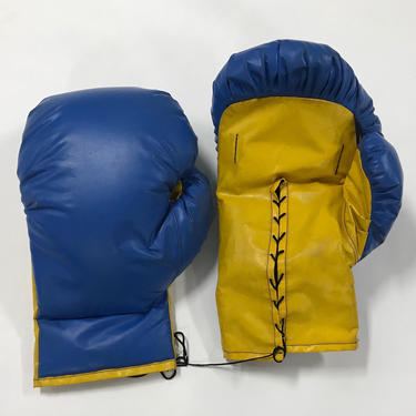 Two pair of giant sized pop art boxing gloves 