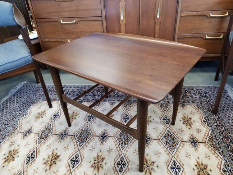 Mid-Century Modern walnut side table with curved edges