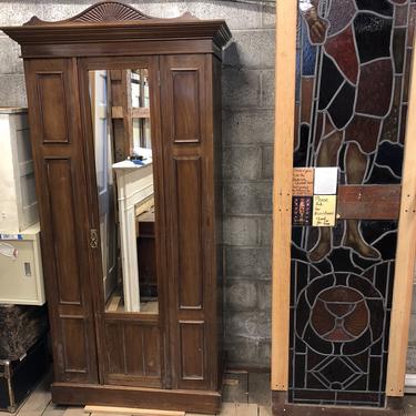 Large  wooden armoire with mirror 73” x 36” x 17”, top crown piece 41” x 20” x 8”