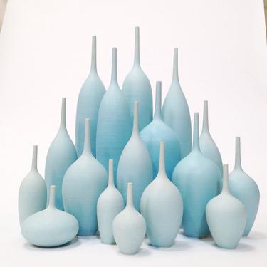 Made to Order - Grand Collection of 17 Stoneware Bottle Vases in Varying Shades of Ice Blue Matte by sara paloma. 