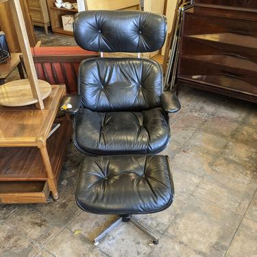 1960s black vinyl eames style lounger with ottoman by plycraft (MCE-7151)