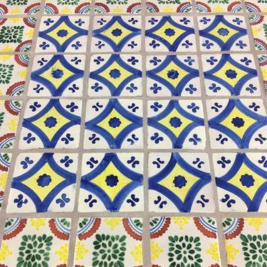 Hand painted vintage Mexican tile pedestal base cafe style table. 