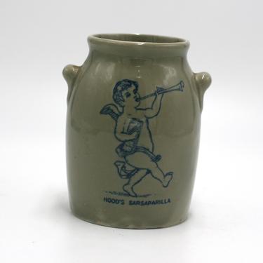 vintage Hood's Sarsaparilla container with cupid 