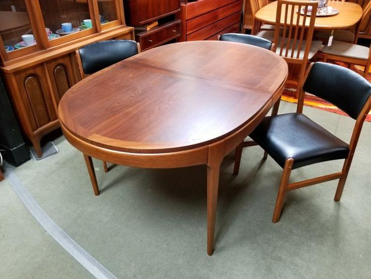 Mid-Century Modern oval walnut dining table from the Rhythm collection by Lane