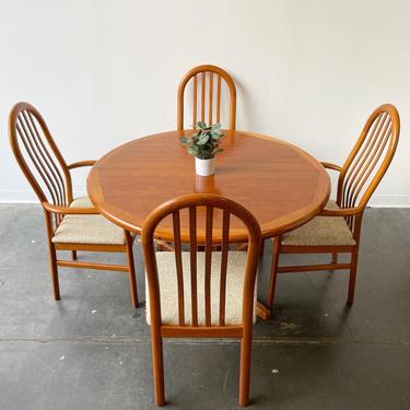 Danish teak expandable round table with six teak chairs by d-scan 