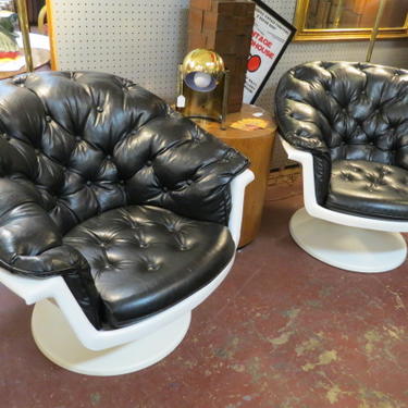 Vintage MCM pair of Atomic swivel lounge chairs