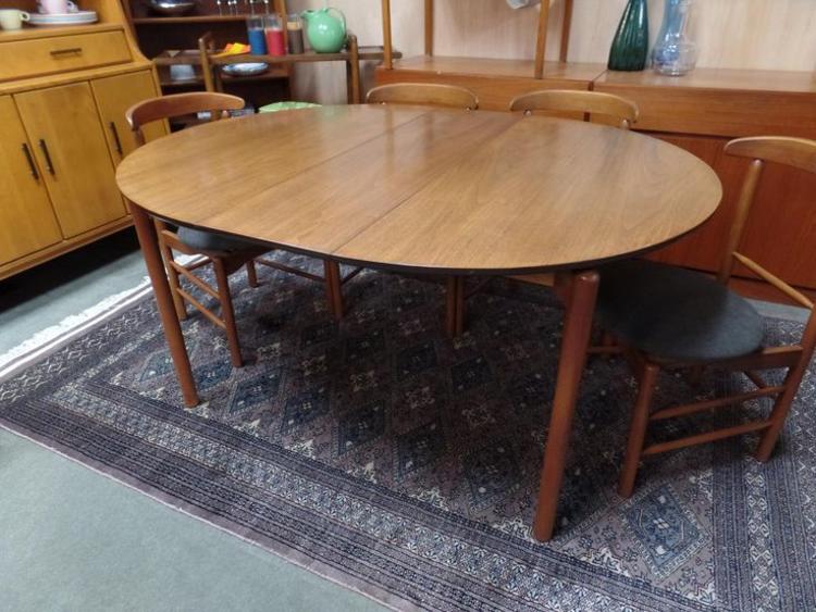 Danish Modern round dining table with one leaf