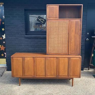Mid Century two-part credenza, with cane detail. 67.25” L x 18” D x 80” T. 