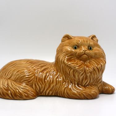 vintage ceramic ginger cat with green eyes 