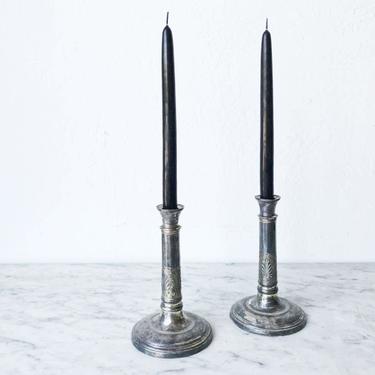Pair of Embossed Silver Candlesticks