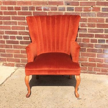 Burnt orange velvet channel back chair
