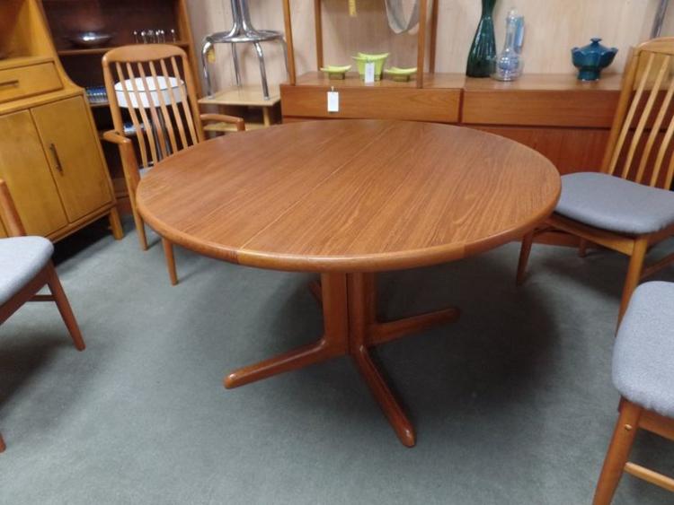 Danish Modern teak round pedestal dining table with two 20" leaves