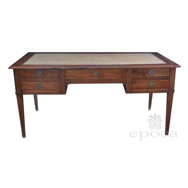 a handsome and richly-colored italian neoclassical walnut 5-drawer writing desk with hand-tooled leather top