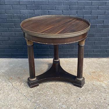 Art Deco Style teapoy table, with reticulated brass trim. 32” diameter x 29” H. 