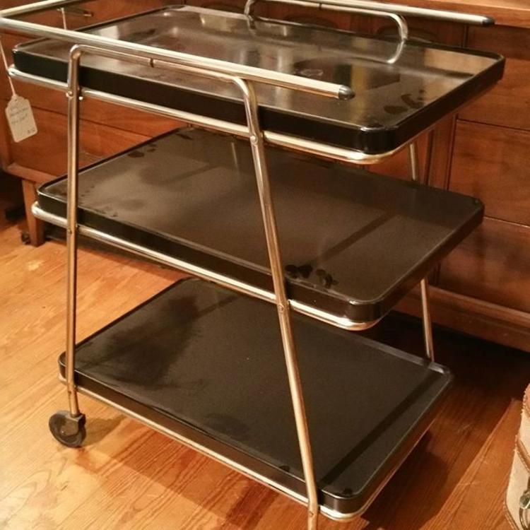 Sleek black art deco style vintage bar cart with removable trays and great atomic-inspired details. $150.