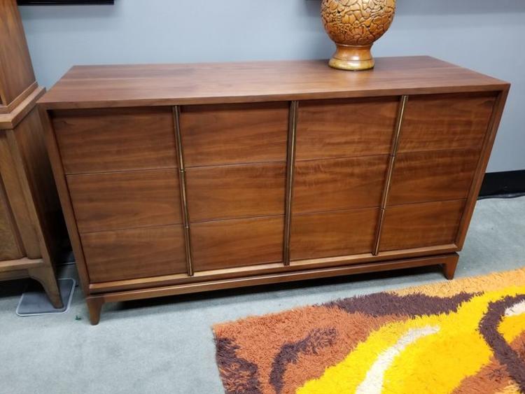 Mid-Century Modern walnut six drawer dresser with brass accents