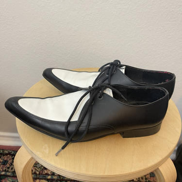 Black and white pointy loafer style Oxford dress shoes 