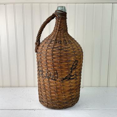 Antique wicker wrapped demijohn - large antique bottle 