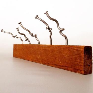 Whimsical coat rack with Fontana Forge's Oops Nails and with reclaimed timber...30 inches in length...Available at the Etsy store for $120.00.