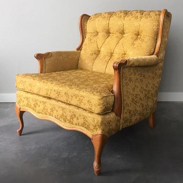vintage tufted gold armchair.