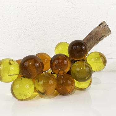 Amber lucite grapes on driftwood