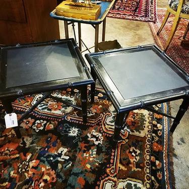 Pair of black rattan side tables with slate inserts. 