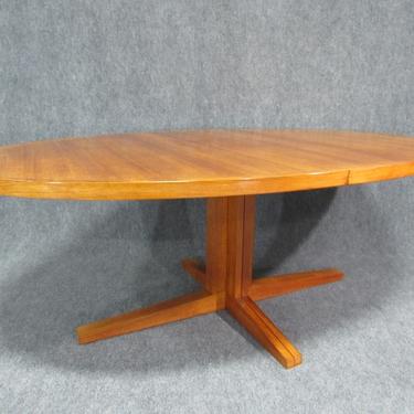 Oval teak extension dining table.  Circa 1960s. - DO NOT POST