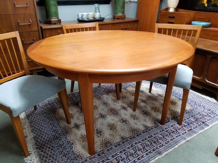 Danish Modern round teak dining table with 3 20"leaves by Falster