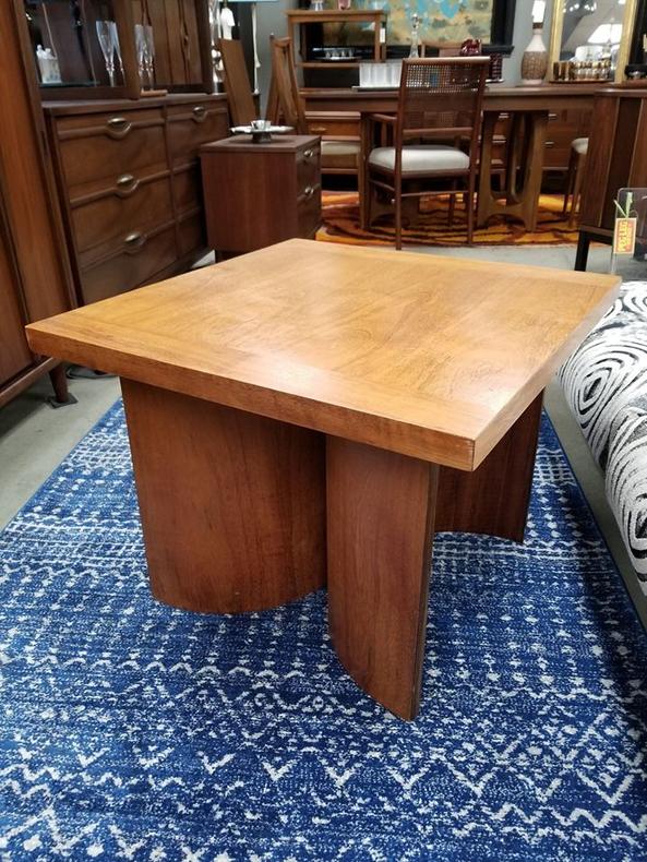                   Mid-Century Modern side table with circular base
