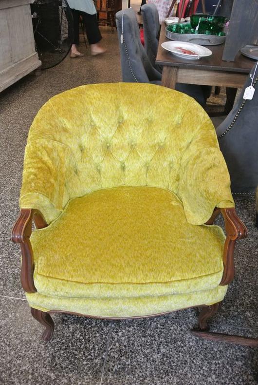 Yellow upholstered chair. $150