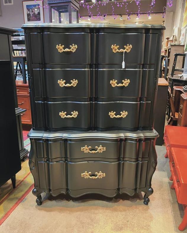 This black painted chest of drawers has a cedar lined drawer (bottom drawer) and a flip up vanity mirror. 