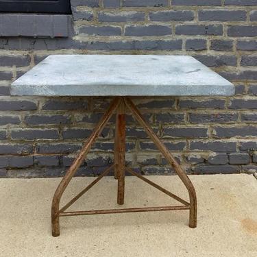Zinc-top industrial table! It's adjustable, and blends its cool blue-gray metal and its rustic metal base beautifully. 
