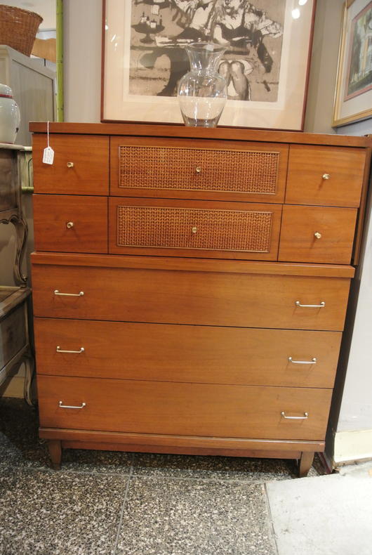 Midcentury modern chest of drawers with brass pulls and woven drawer fronts