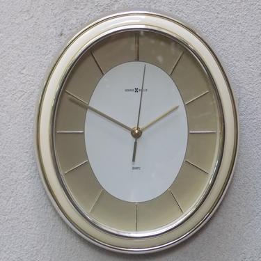 Howard Miller Oval Gold White Quartz Wall Clock from the 1980s 